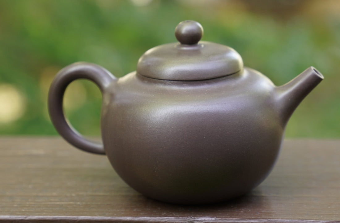 http://www.meimeitea.com/cdn/shop/files/tea-ware-artisan-yixing-zisha-purple-clay-teapot-buddhist-guo-yuan-453.jpg?v=1694881519