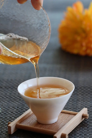 a close up of a coffee cup sitting on top of a wooden table