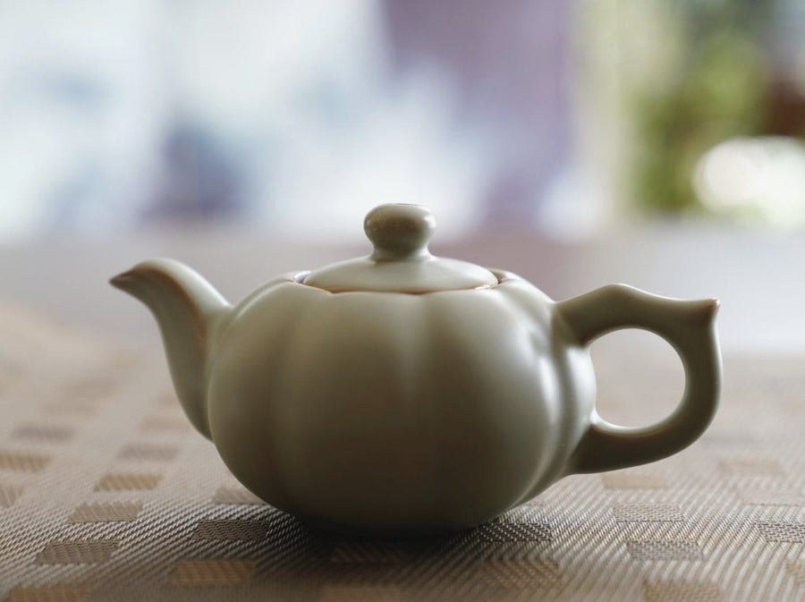 https://www.meimeitea.com/cdn/shop/files/tea-ware-ru-kiln-porcelain-sunflower-teapot-and-teacup-set-696_900x.jpg?v=1695516232
