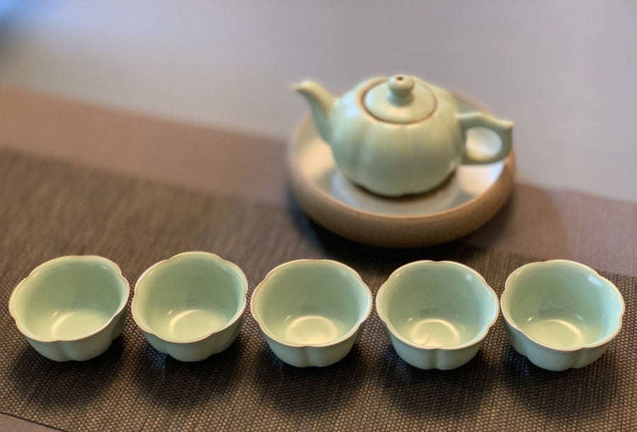 https://www.meimeitea.com/cdn/shop/files/tea-ware-ru-kiln-porcelain-sunflower-teapot-and-teacup-set-901_900x.jpg?v=1695516241