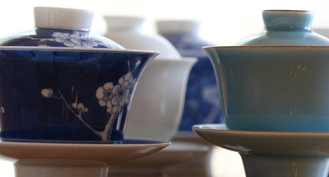 a close up of a coffee cup sitting on top of a wooden table